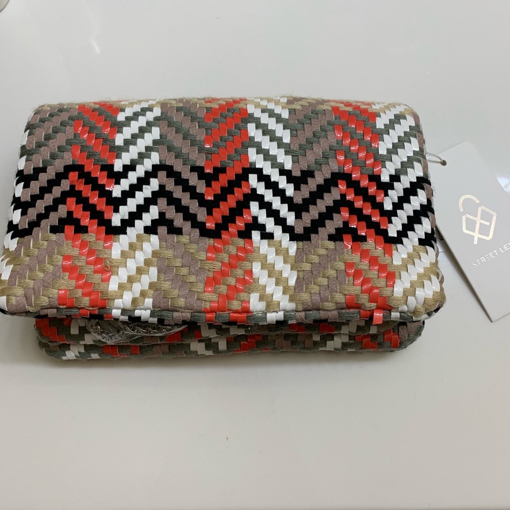 Woven clutch with removable silver chain strap